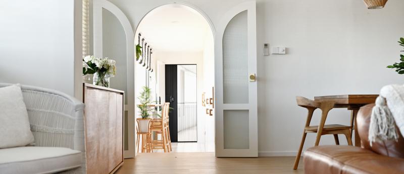 Arched doorway into a modern luxury home 