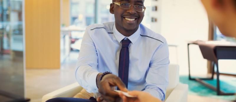 man giving out his business card