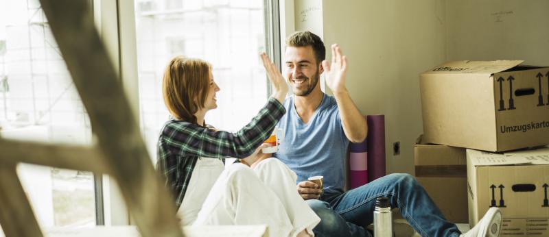 couple high-fiving renovation project