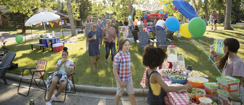 people attending a neighborhood street party