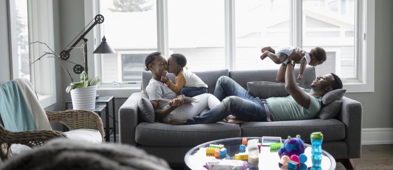 mom and with small children on couch