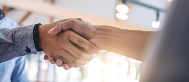 man and woman shaking hands (closeup)
