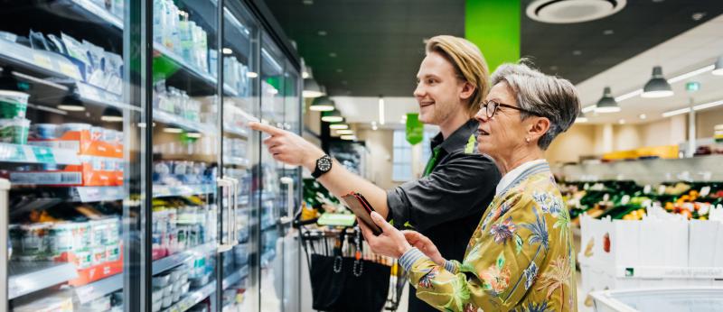 Grandmother and grandson shopping for groceries