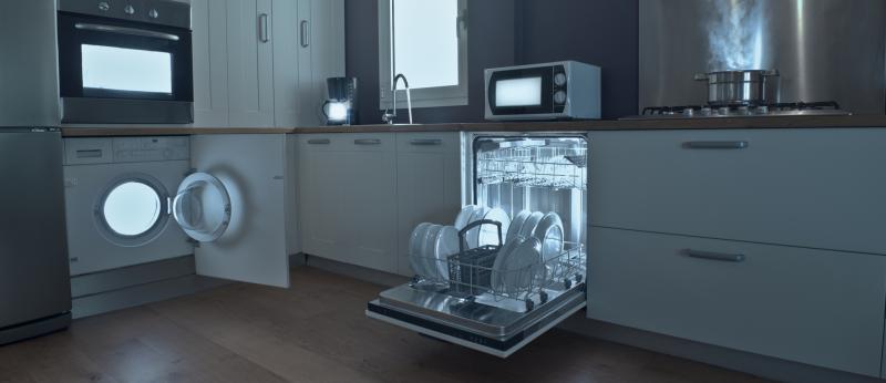 Kitchen with lights inside dishwasher, stove, washer and microwave