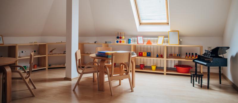 Table and desk in a top floor room used for teaching from home