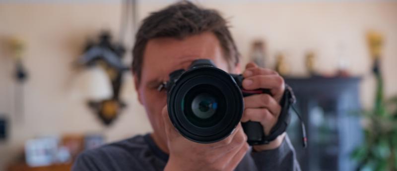 Camera faced toward viewer with living room in background