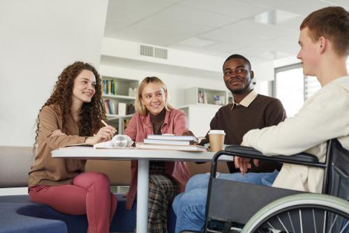 young people sitting at table