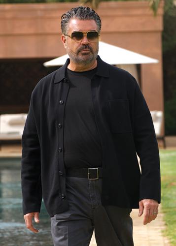 Photo of Billy Nash in front of luxury property