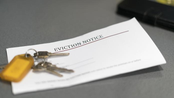Eviction letter with keys sitting on top