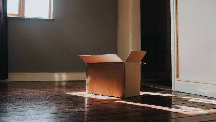 Cardboard box in empty room