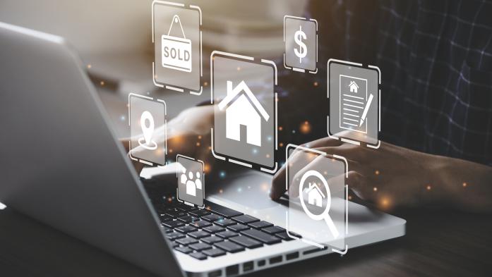 laptop with real estate illustrations