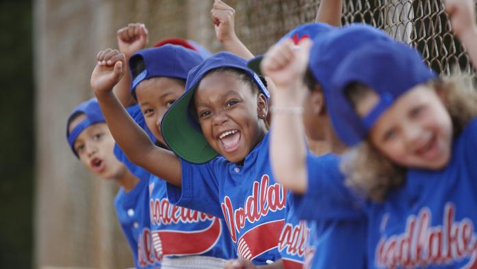 Youth baseball players cheering