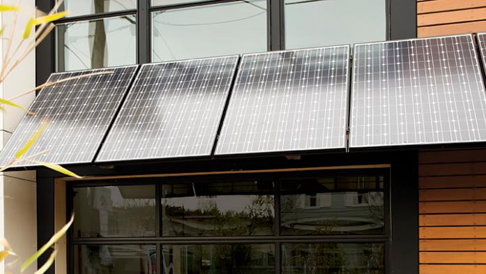 Photo of a modern home with solar panels