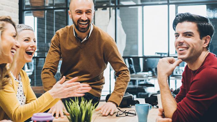coworkers enjoying a business meeting around a table