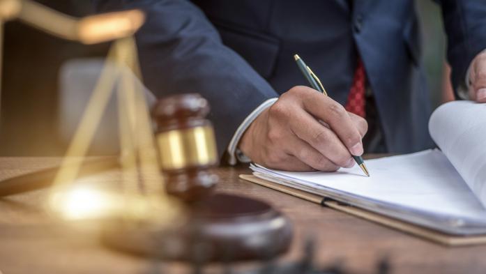 Man signing paperwork