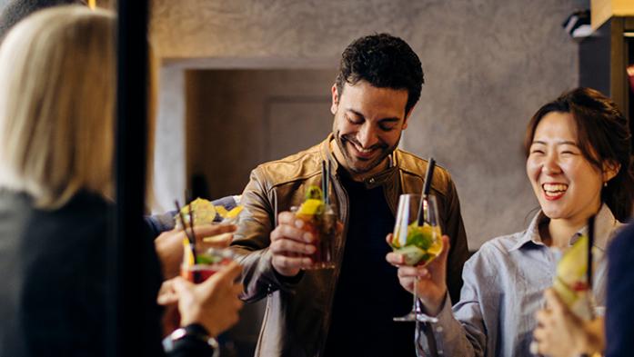 A group of business colleagues celebrating at happy hour