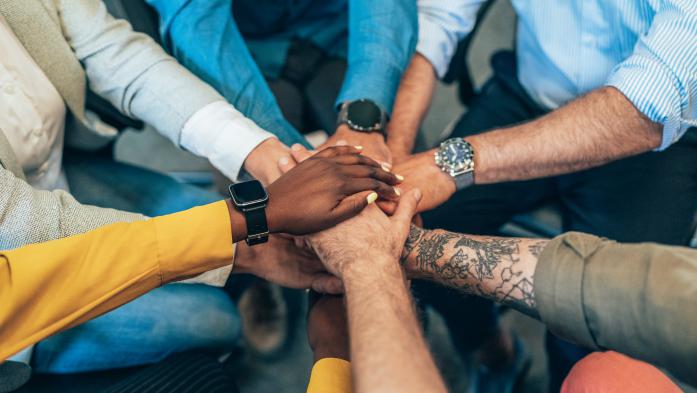 diverse hands in a circle