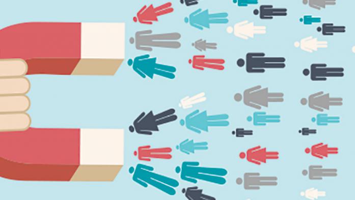 illustration of a hand holding a magnet drawing people in