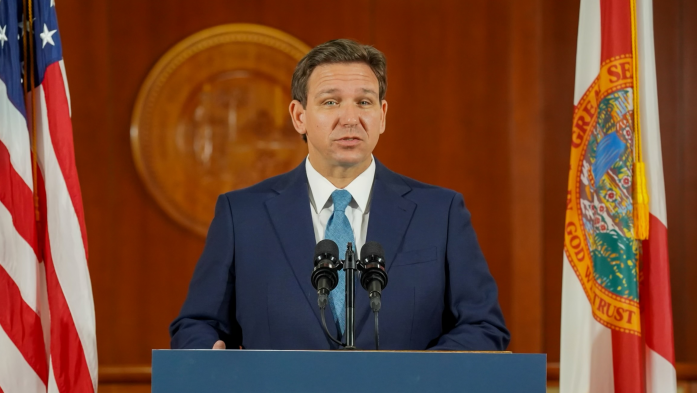 Gov. Ron DeSantis speaks at a podium