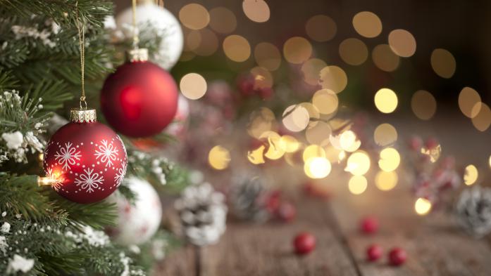 Christmas tree with red and white ornaments and defocused white lights