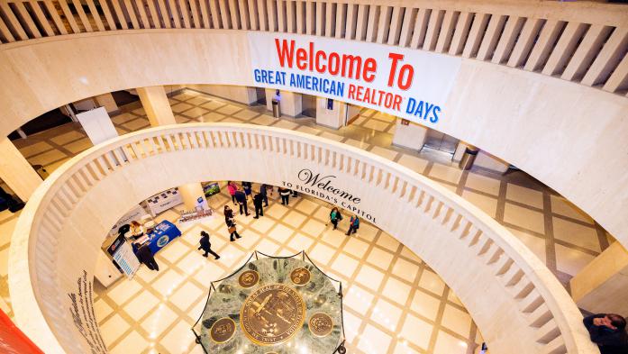 state capitol rotunda with Great American Realtor Days banner