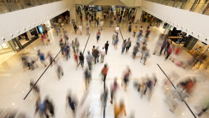 blurred photo of people in a shopping center