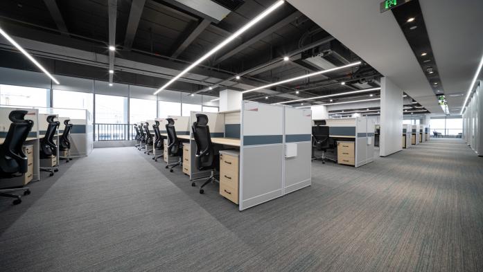 office space with rows of empty desks