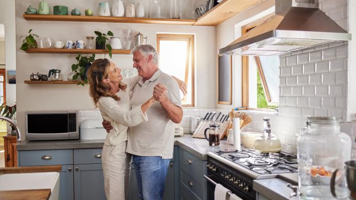older couple dancing in kitchen