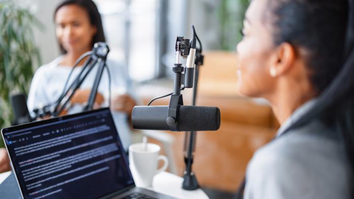 Two women in live podcast