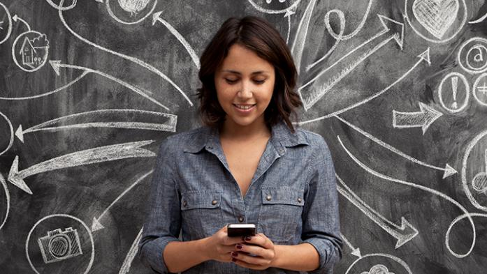 photo of woman infront of a chalkboard with social media symbols