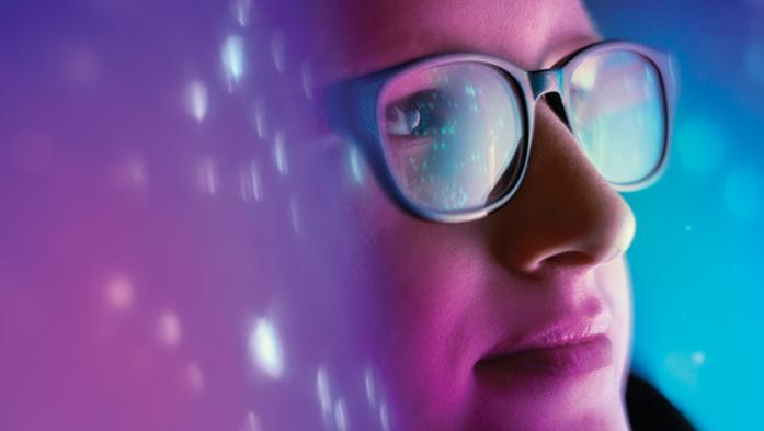photo of a woman looking into cyberspace blue background