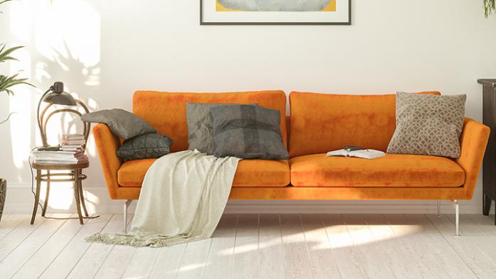 Photo of a living room with a modern orange couch and other modern decor