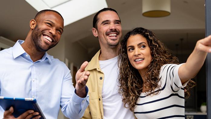 Real estate with young couple looking at a property