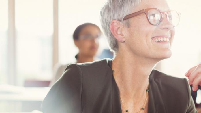 woman smiling in a class