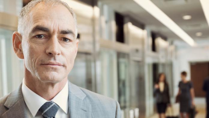man in suit in an office