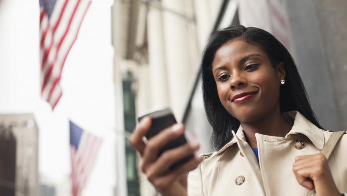 woman looking at cell phone