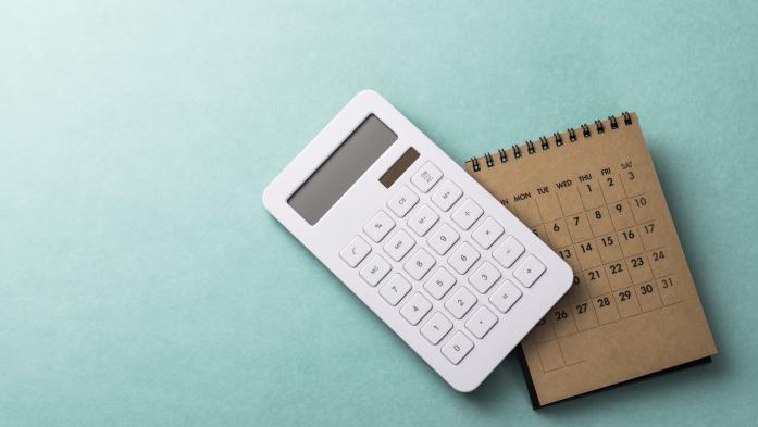 photo illustration of a calculator and a calendar