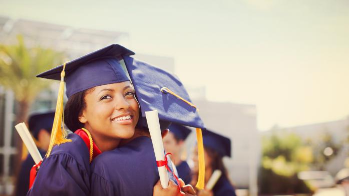 Graduates hugging