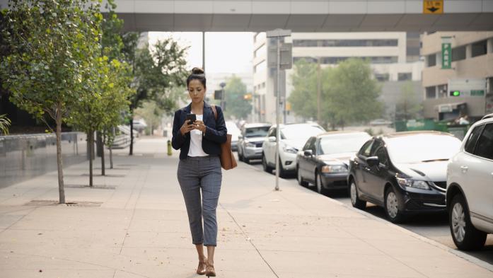 woman using cell phone texting