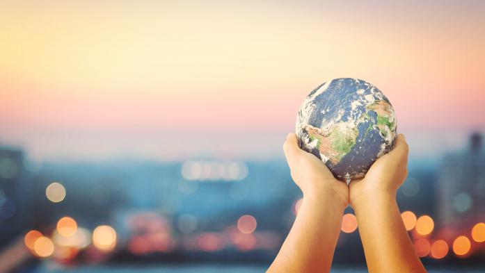 hands holding a globe