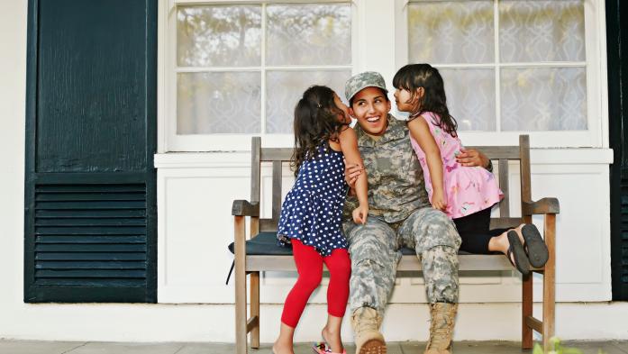 veteran family on bench on porch