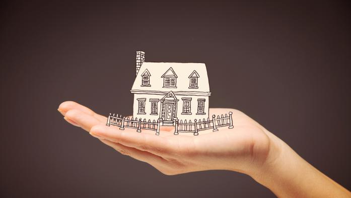 illustration of hand holding a house 