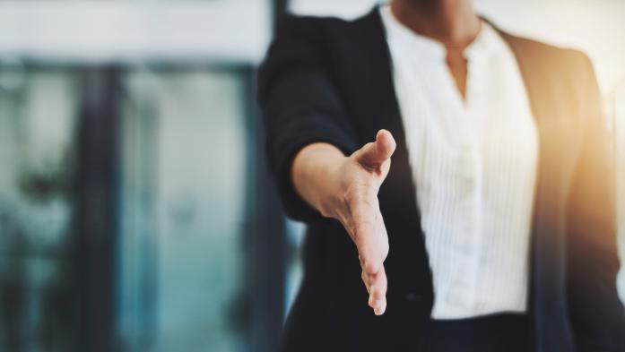 woman extending hand for handshake