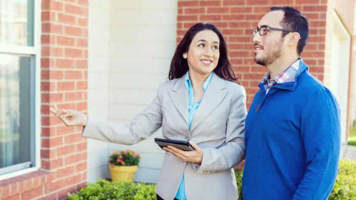 realtor showing a house