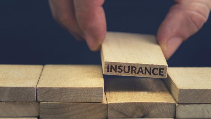Blocks with one that says insurance