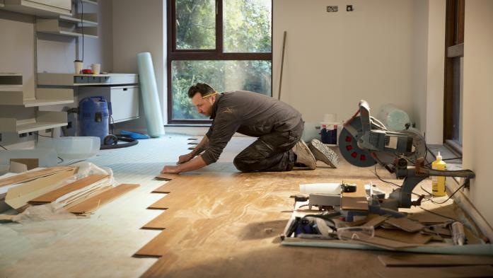 Man installing hardwood floors