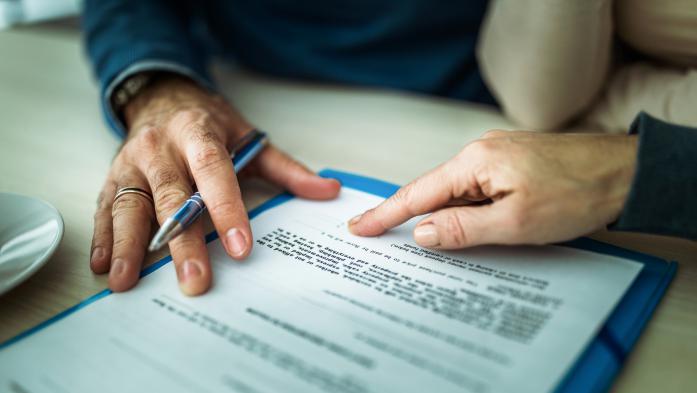 Hands on legal paperwork