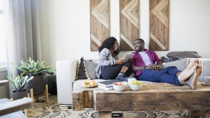 Young couple relaxing on couch