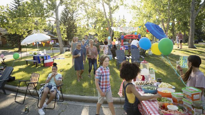 people attending a neighborhood street party