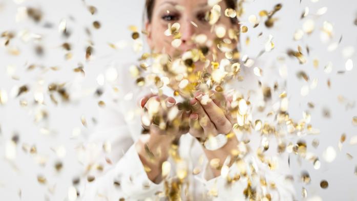 woman throwing confetti